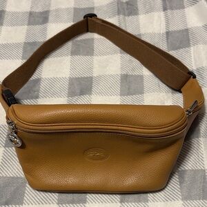 Longchamp Le Foulonné Belt Bag in caramel cowhide leather.